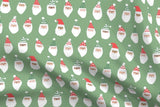 Cheerful Santas in Green
